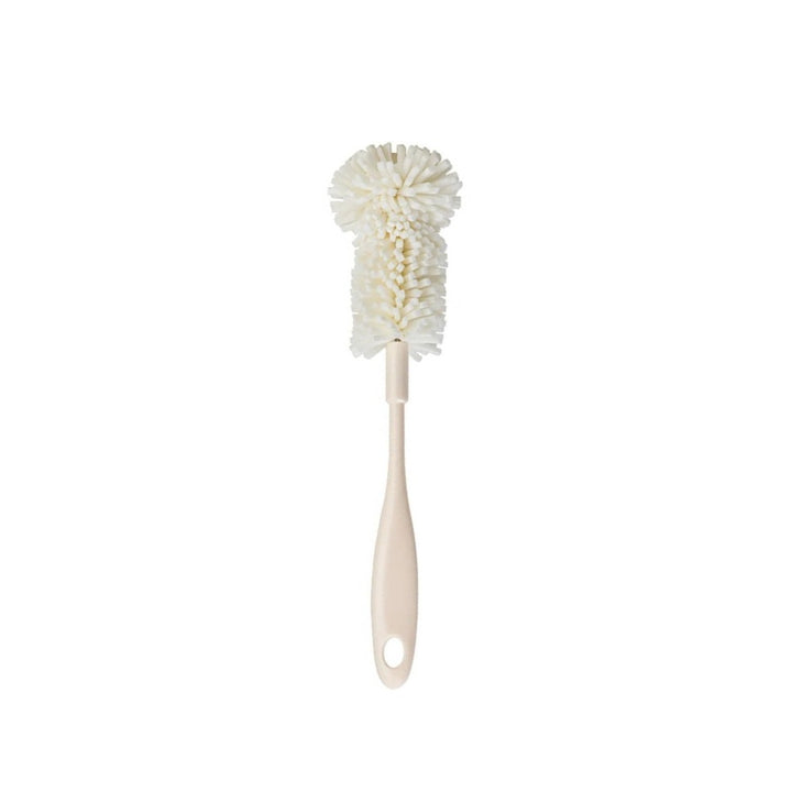 A product photo of a short cleaning brush with a polyester mop-like head used for cleaning the chamber of a vacuum pump