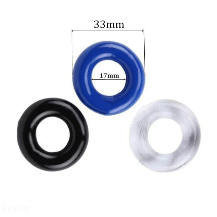 An image with three cylindrical cock rings on a white background. The blue cock ring has dimensions of 33 mm in total diameter and 17 mm in inner diameter.