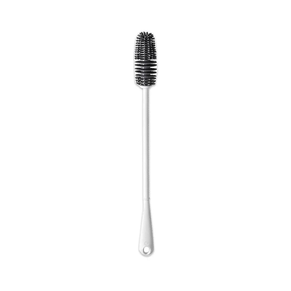 Product photo of a white silicone long cleaning brush for vacuum pump cylinders