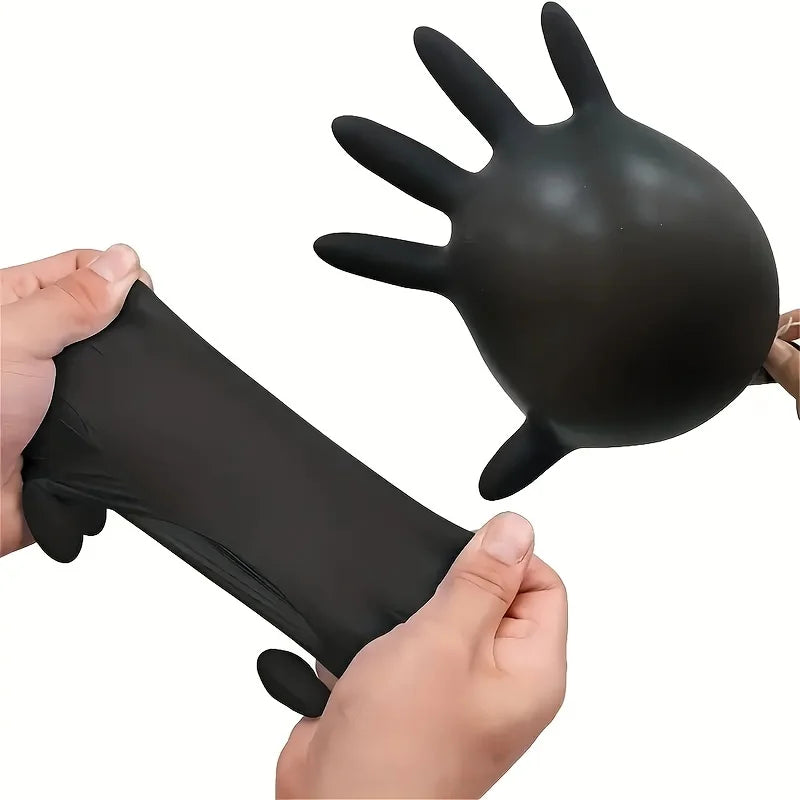 An image of a two black nitrile gloves; one is blown up so it looks like a turkey to show its stretchiness, and the second is pulled by a person at both sides to also show its elastic material