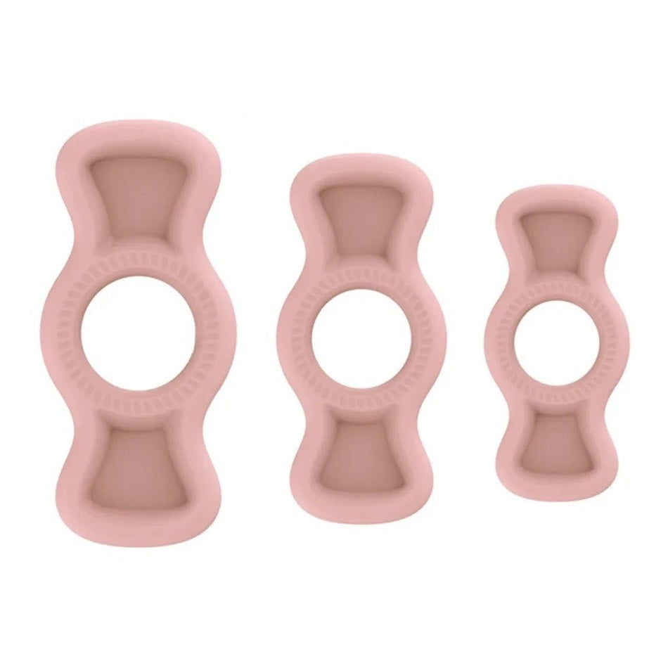 An image of three pink flesh colored silicone premium cock rings with pullable side tabs. The cock rings have small grooves for breathability, embossed tabs for easy grip, and are made of a soft and hygienic medical silicone material.
