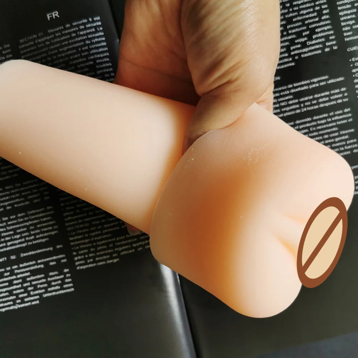 Image of a man holding a flesh-colored premium penis pump sleeve showing the side view