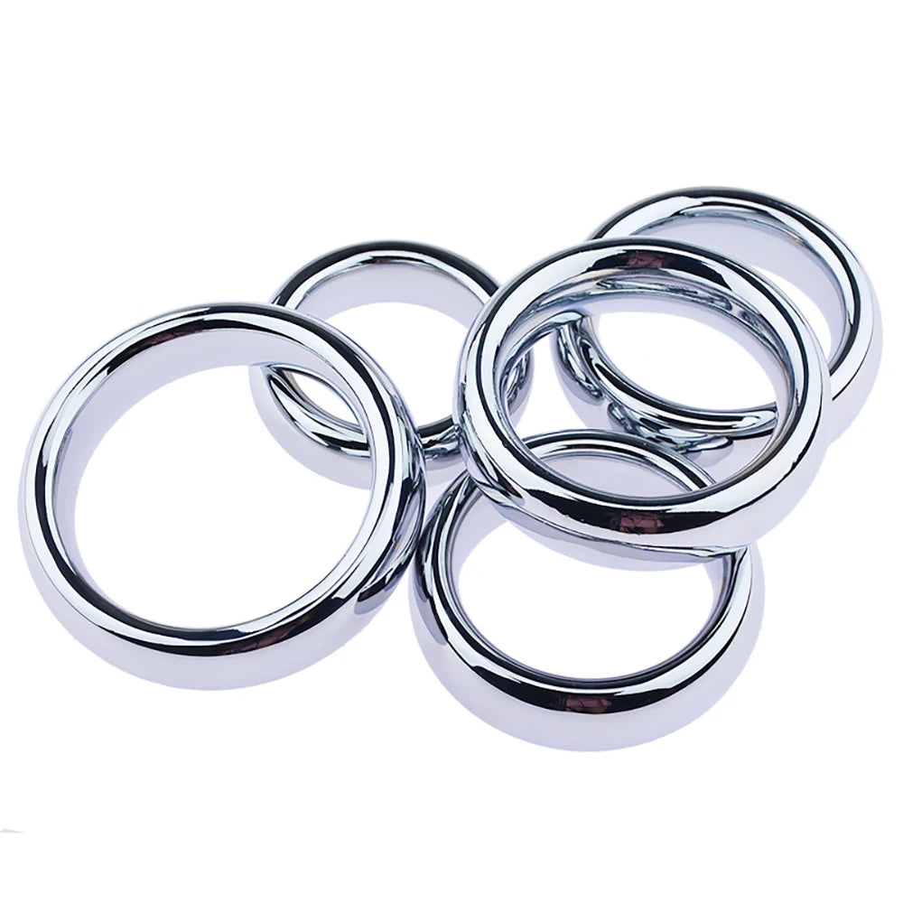 A set of five premium stainless steel cock rings with shiny polished finishes, stacked on top of each other on a white background