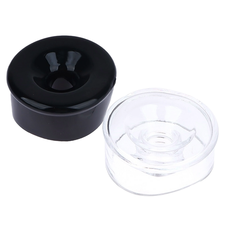 The image shows two silicone sleeve covers for penis pump cylinders, one black and one transparent. Both have a rounded shape with a central hollow part for inserting the penis for a pumping session.