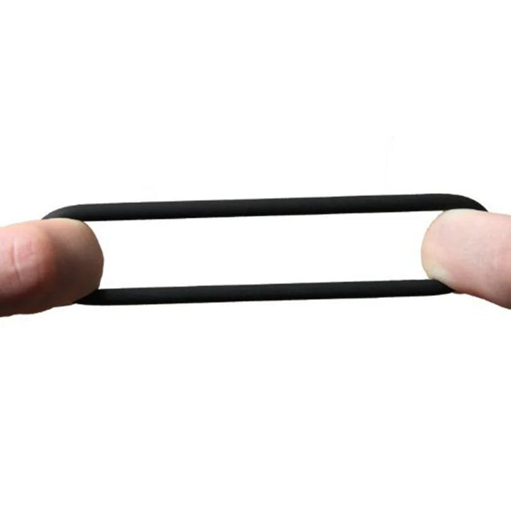 An image showing the stretchiness of the single-bead cock ring with a man pulling it from both sides