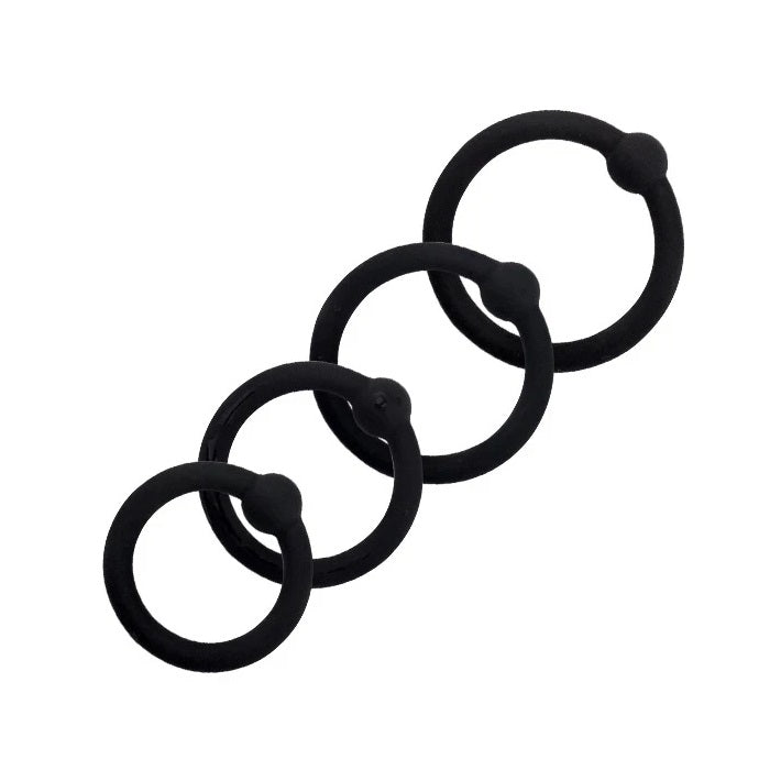 A set of four black silicone cock rings with a single bead design, displayed in a stacked layout of different sizes