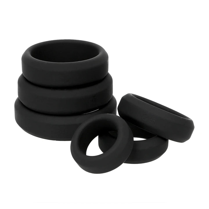 Image showing a stack of three flat cock rings and three loose flat cock rings next to it