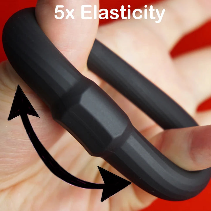 Black silicone rubber constriction band being stretched with text '5x Elasticity' on a red background