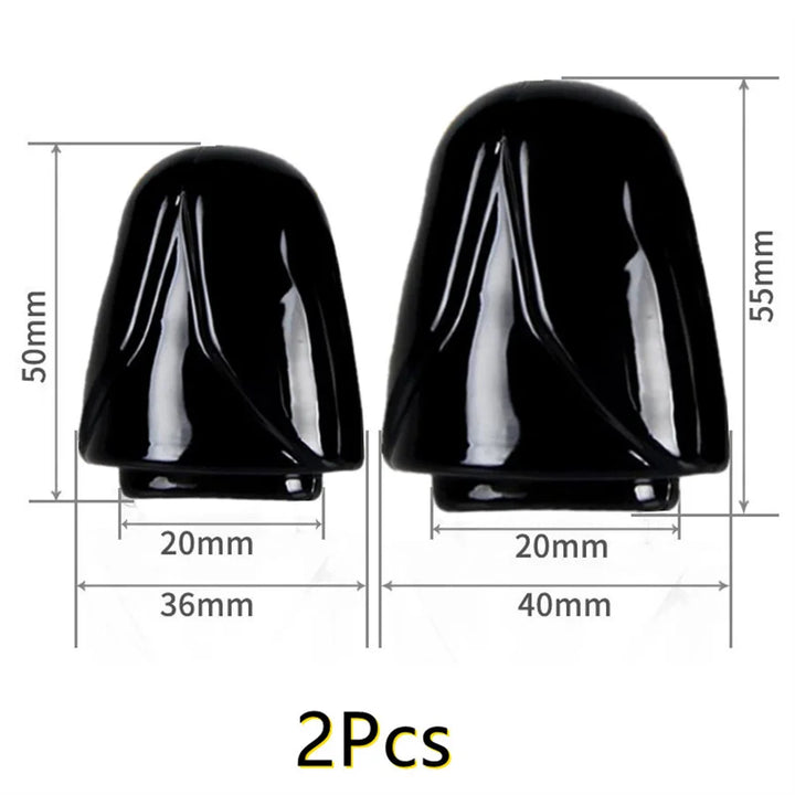 Two black glans cap penis head covers with dimensions on a white background.