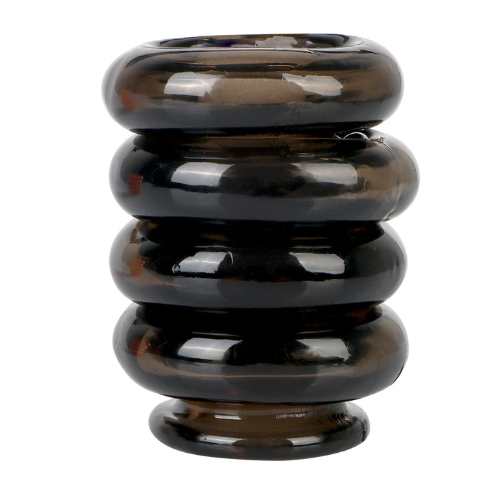 This image shows four black silicone interlocking cock rings in a vertical stack on a white background