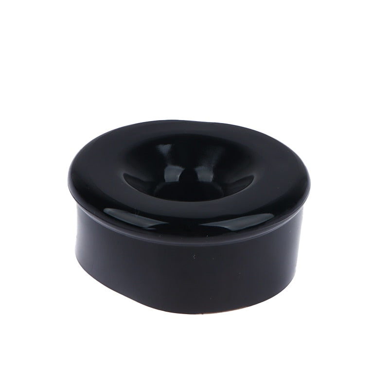 One black silicone sleeve cover to wrap around the opening of a penis pump cylinder with a hollow center for penis insertion
