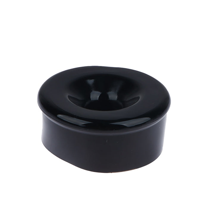 One black silicone sleeve cover to wrap around the opening of a penis pump cylinder with a hollow center for penis insertion
