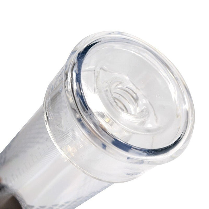 A clear transparent silicone sleeve affixed to a round cylindrical tube of a vacuum pump