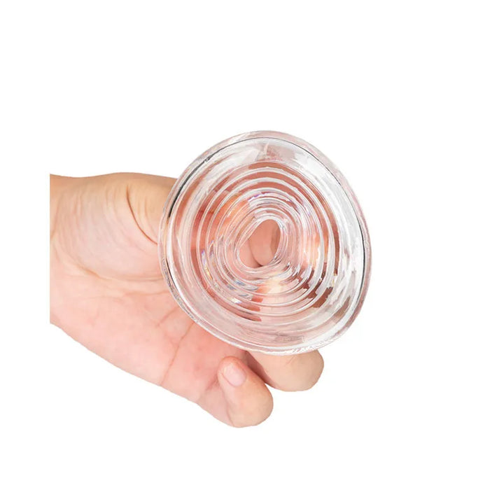 A clear ribbed sleeve cover being held in a man's hand