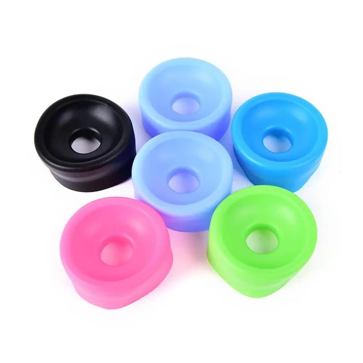 An image showing a cluster of six vacuum pump cylinder sleeve covers in various colors of black, light blue (2), blue, green, and pink