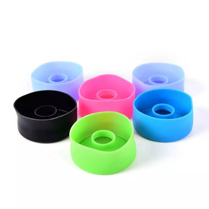 Six penis pump sleeve covers in various colors turned upside down showing their inside on a white background