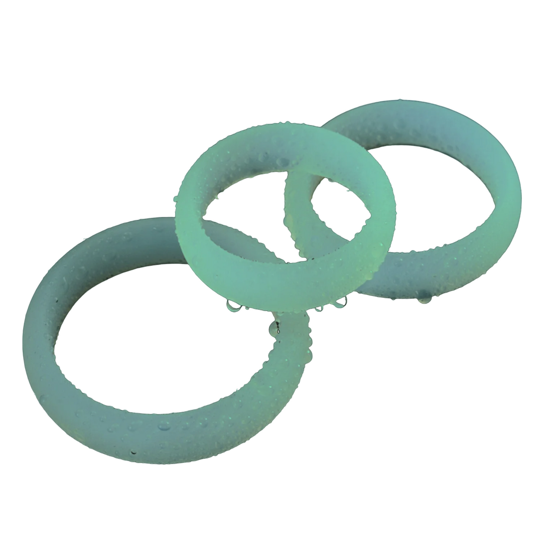 Three glow-in-the-dark teal silicone cock rings in different sizes displayed on a white background.