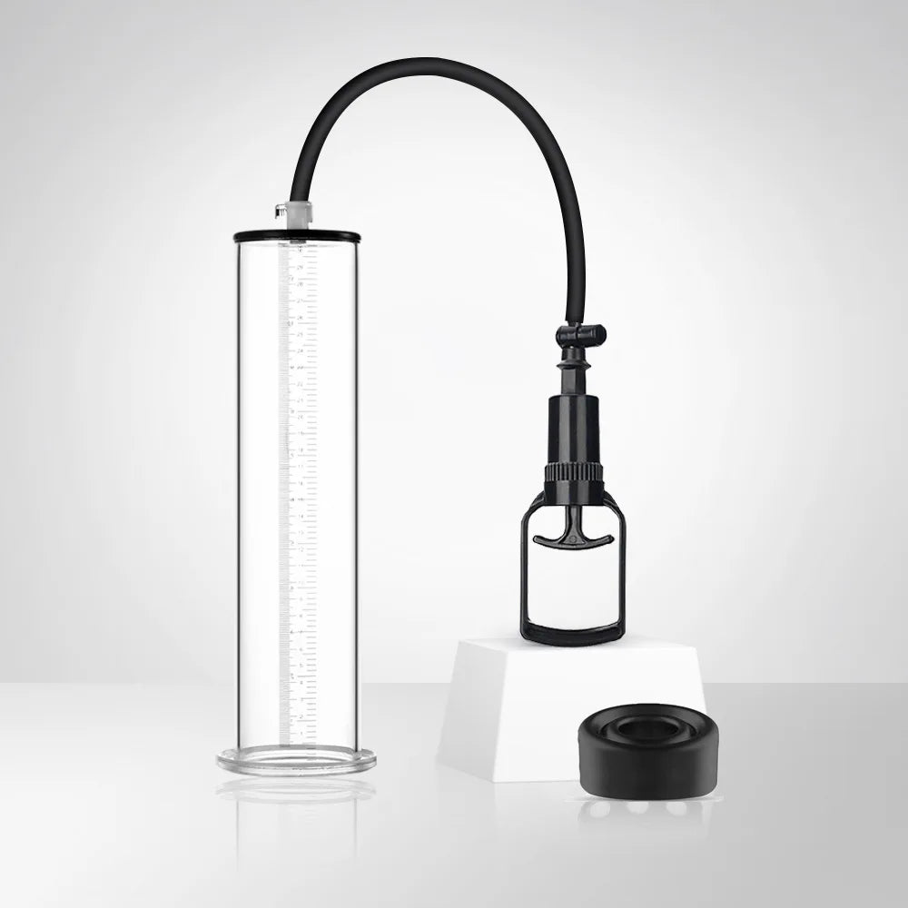 This photo shows a high-efficiency penis pump with a clear acrylic cylinder, black flexible long hose, and black manual handle lever on a white showcase block, with a black silicone sleeve
