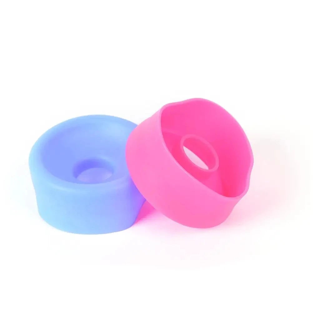An image showing a light blue sleeve cover and a pink sleeve cover resting on the other, on a white background