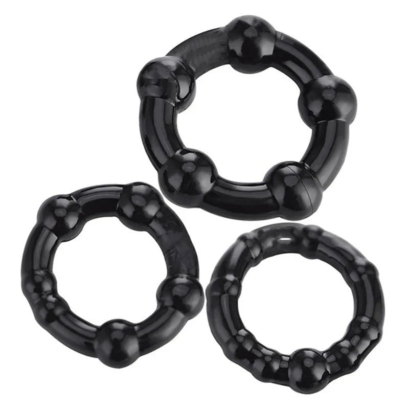 An image showing three black cock rings of different sizes, all with circular ridges molded into the ring design to help with pressure control and handling