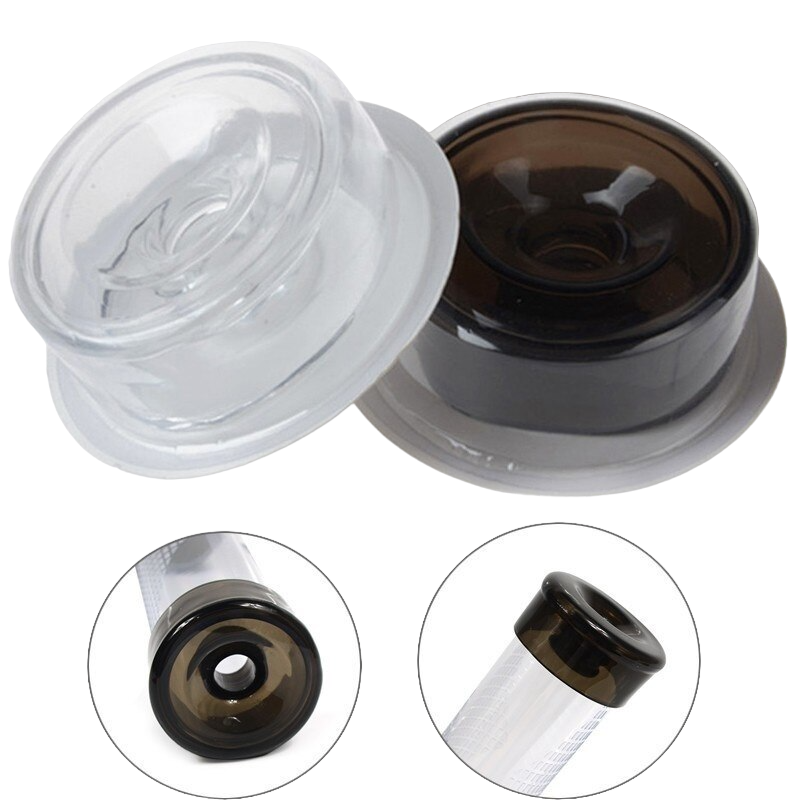 One transparent and one black silicone sleeve cover in their packaging, with two photos on the bottom showing how the black silicone sleeve should look when affixed to the cylinder.
