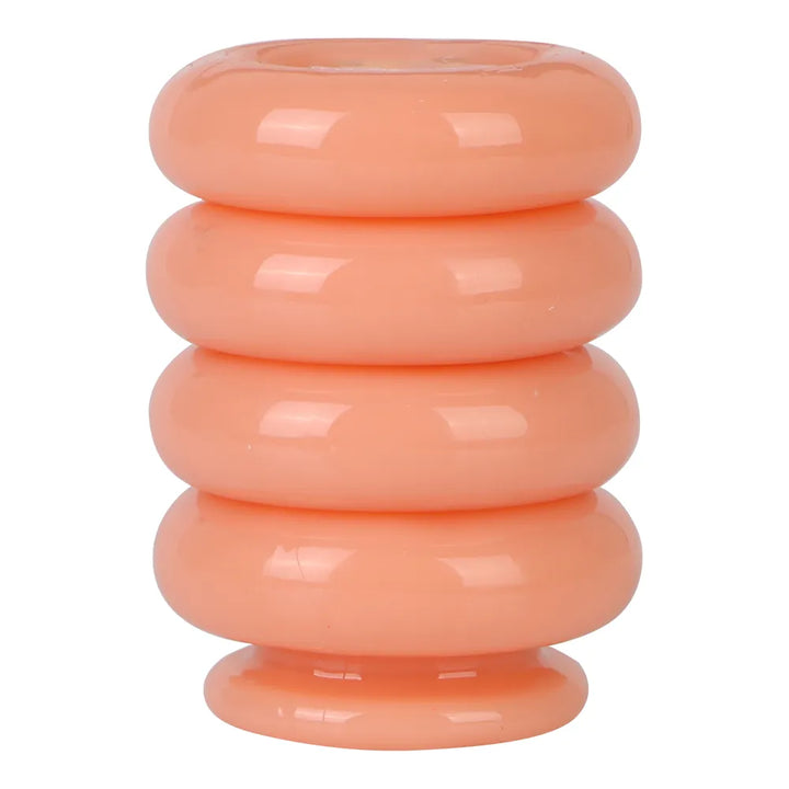 This image shows four orange flesh colored silicone interlocking cock rings in a vertical stack on a white background