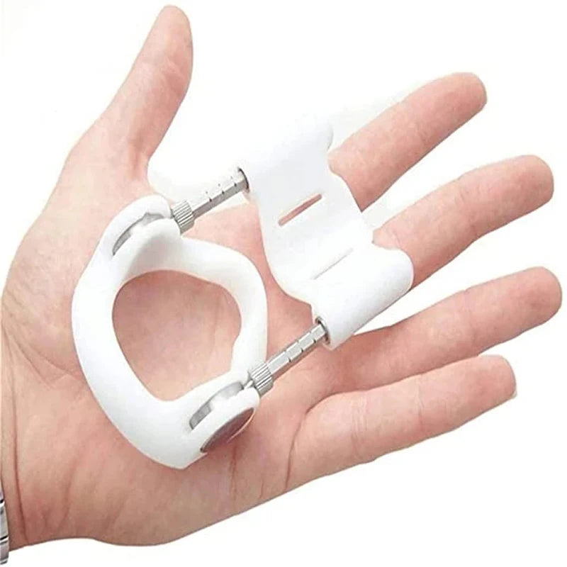 An image of a man holding the prostretch penis extender in its smallest state