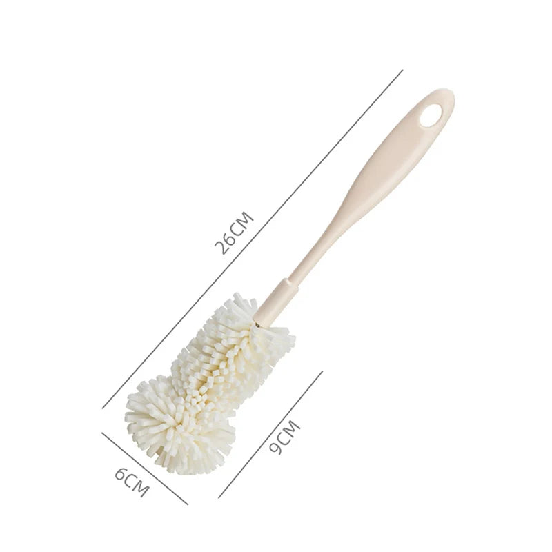 Dimensions of the short polyester penis pump cleaning brush measuring 26 cm long, with a mop-like head that is 6 cm wide and 9 cm long