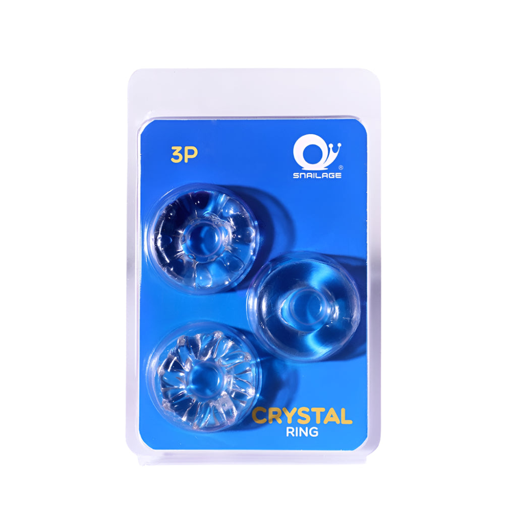 Packaged silicone clear cock rings with various textures with one smooth, one ribbed, and one ridged on a blue background.