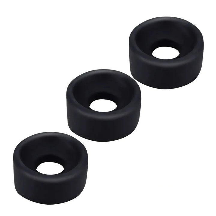 Three black silicone sleeve covers for penis pumps, displayed as a thin cylindrical ring shape with varying diameters.