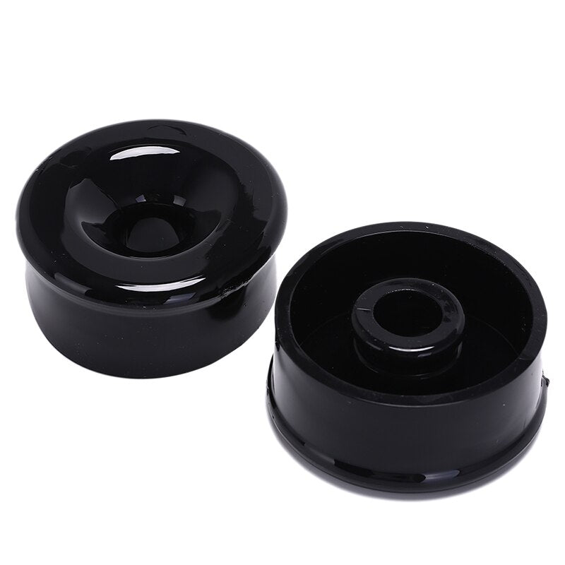 Two black silicone sleeve covers to wrap around a vacuum pump cylinder. One silicone sleeve is facing up and the other is facing down, showing both sides of the silicone sleeve.