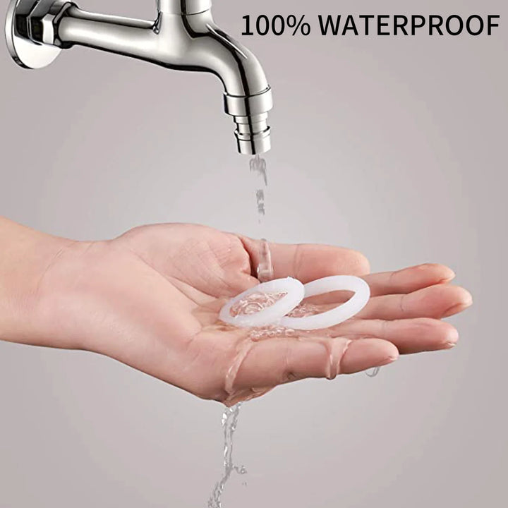 An image showing a man holding two white glow in the dark cock rings under a faucet with running water hitting the cock rings to show that they are waterproof material