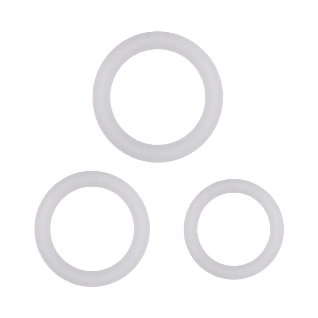 An image showing three white glow in the dark cock rings of varying sizes